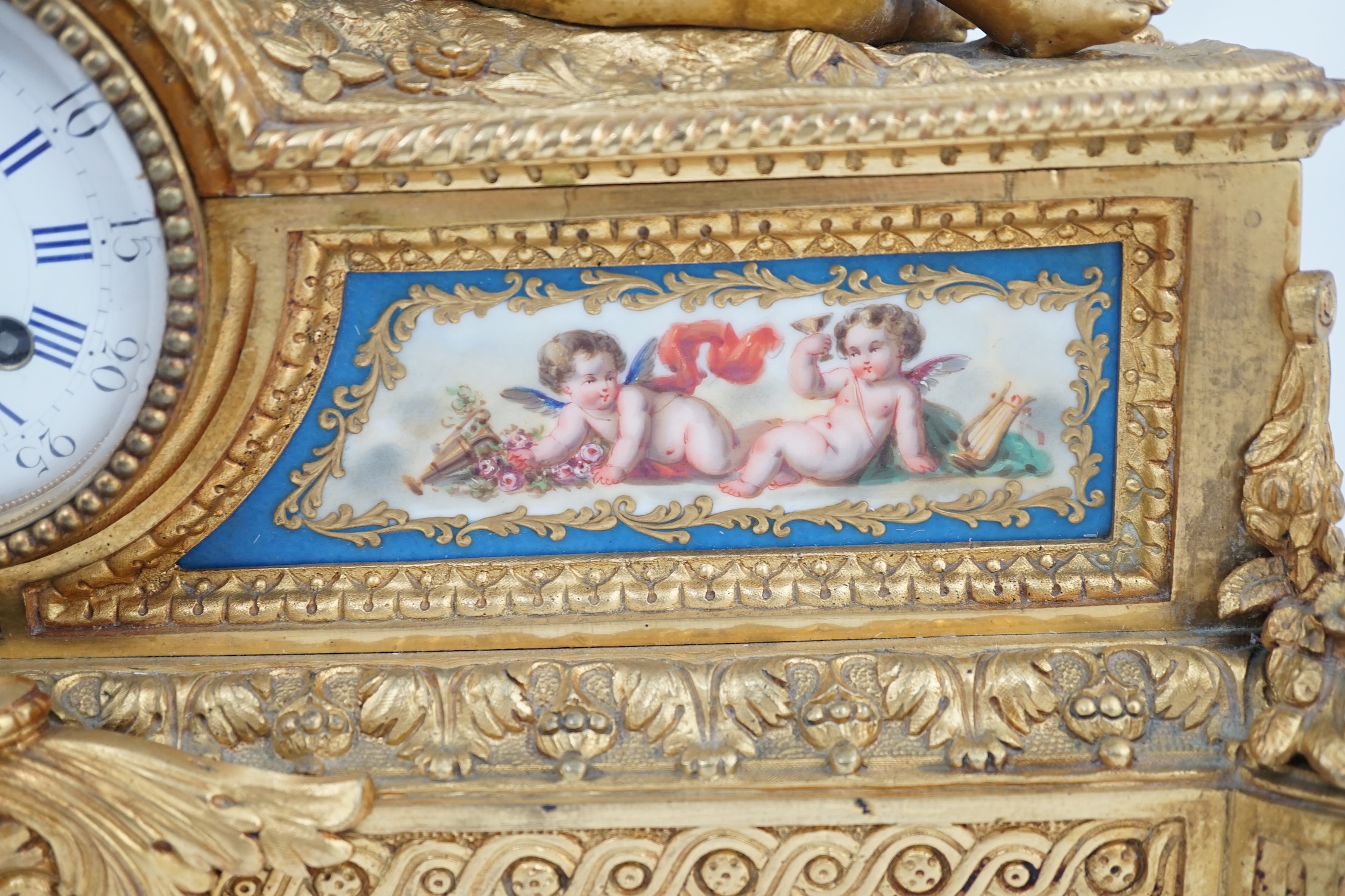 A 19th century French ormolu and Sevres style porcelain mantel clock